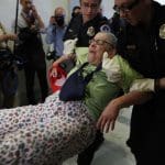 Protesters in wheelchairs physically removed from McConnell’s office over Medicaid cuts