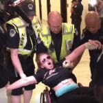 Protesters dragged from wheelchairs raise thousands to cover legal fees following arrest