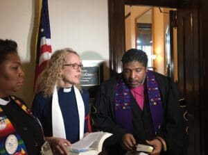 Clergy protest the GOP's health care bill outside Mitch McConnell's office
