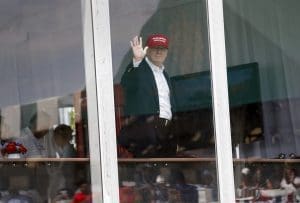 President Donald Trump waves from his presidential viewing stand Saturday, July 15, 2017, during the U.S. Women's Open Golf tournament at Trump National Golf Club in Bedminster, N.J. (AP Photo/Carolyn Kaster)