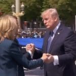Trump’s final France embarrassment is a three-way extended handshake