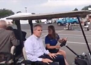 Ohio Republican Sen. Rob Portman flees in a golf cart from voters' questions.