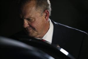 Former Alabama Chief Justice and U.S. Senate candidate Roy Moore gets in his car after he speaks at a revival, Tuesday, Nov. 14, 2017, in Jackson, Ala. (AP Photo/Brynn Anderson)