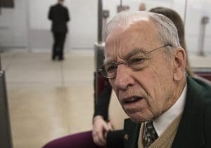 Senate Judiciary Committee Chairman Chuck Grassley, R-Iowa, whose panel is investigating Russian meddling in the U.S. elections, listens to a reporter's question about the case as he boards a tram between the Capitol and the Senate office buildings following final votes, in Washington, Thursday, Dec. 14, 2017. Some House Republicans ratcheted up criticism of special counsel Robert Mueller's probe into Russian meddling Wednesday, questioning whether there was bias on his team of lawyers but stopping short of calling for his firing or resignation.