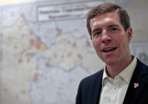 Democrat Conor Lamb, stands in front of the map of the congressional district he is running to represent while at a campaign office, Wednesday, March 7, 2018 in Carnegie, Pa. Lamb is running against Republican Rick Saccone in a special election being held on March 13 for the PA 18th Congressional District vacated by Republican Tim Murphy.