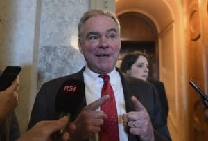 Sen. Tim Kaine, D-Va., talks with reporters on Capitol Hill in Washington, Monday, Jan. 22, 2018, after passage of a procedural vote aimed at reopening the government.