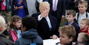 U.S. President Donald Trump (C) points to members of the news media while writing messages to military troops during the 140th annual Easter Egg Roll on the South Lawn of the White House April 2, 2018 in Washington, DC. The White House said they are expecting 30,000 children and adults to participate in the annual tradition of rolling colored eggs down the White House lawn that was started by President Rutherford B. Hayes in 1878. Chip Somodevilla / Pool via CNP ' NO WIRE SERVICE ' Photo by: Chip Somodevilla/picture-alliance/dpa/AP ImagesChip Somodevilla / Pool via CNP ' NO WIRE SERVICE ' Photo by: Chip Somodevilla/picture-alliance/dpa/AP Images