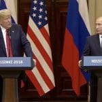 Trump attacks US probe of Russian interference right in front of Putin