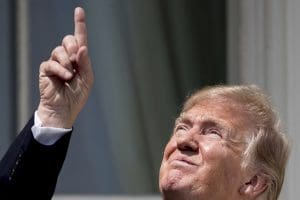 Donald Trump pointing at sky