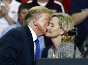 Trump kisses Cindy Hyde-Smith on cheek at rally.