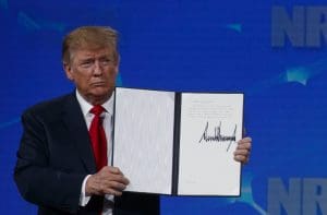 Trump at NRA with signed document