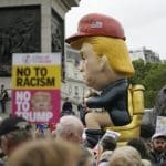 Trump insists protests aren’t real as thousands fill the streets to say he’s not welcome