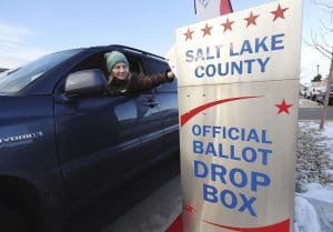 Voter at ballot drop box in Utah