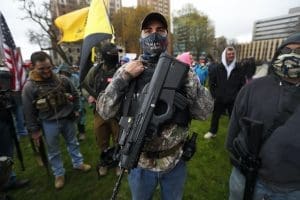 Protester with rifle