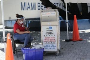 Florida ballot box and poll worker