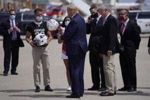 Donald Trump autographs helmet for Permian HS football player