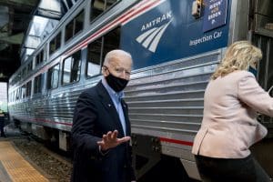 Joe Biden and his wife, Jill, board an Amtrak train.