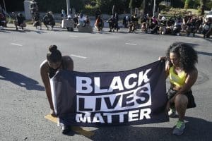 Black Lives Matter protesters kneeling