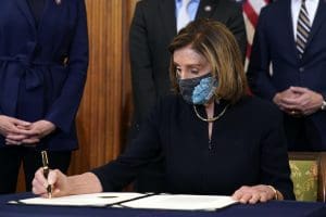 Nancy Pelosi signs impeachment