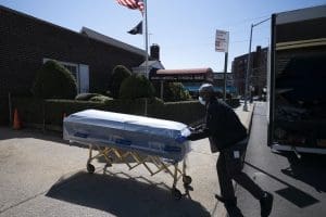 Worker bringing coffin to funeral home