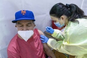 Nurse vaccinating man in the Bronx