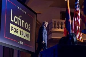 Donald Trump with Latinos for Trump sign