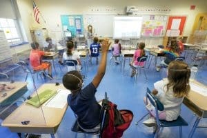Kids socially distanced in a classroom, May 2021
