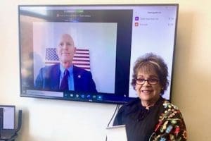 Maria Weese, with Rick Scott on screen