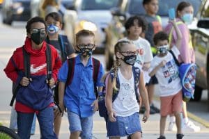Students wear protective masks