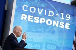Joe Biden with COVID Response sign