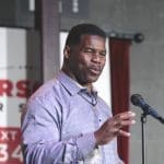 Herschel Walker is advertising on social media site popular with white nationalists