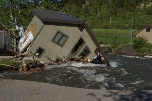 House in creek in Yellowstone after flooding