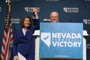 Sen. Catherine Cortez Masto, left, alongside Nevada Gov. Steve Sisolak during an election night party hosted by the Nevada Democratic Party on Tuesday, Nov. 8, 2022, in Las Vegas.