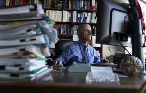 Dr. Anthony Fauci, director of the National Institute for Allergy and Infectious Diseases, works at his desk in his office at the National Institutes of Health, Dec. 19, 2017, in Bethesda, Maryland.