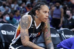 Brittney Griner sits during the first half of Game 2 of the WNBA Finals against the Chicago Sky, Wednesday, Oct. 13, 2021, in Phoenix.