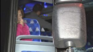 This image provided by WJLA shows migrant families on a bus near the Vice President's residence after they arrived in Washington, Saturday, Dec. 24, 2022.