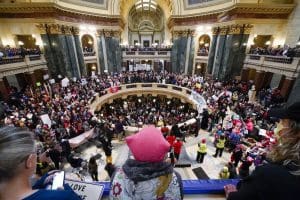 Protesters in the Wisconsin Capitol Rotunda demonstrate in support of overturning the state's near total ban on abortion on Sunday, Jan. 22, 2023, in Madison.
