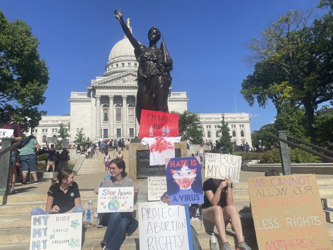 Protesters gathered outside the state Capitol building in Madison, Wis., Friday, June 24, 2022 evening in advance of a protest.