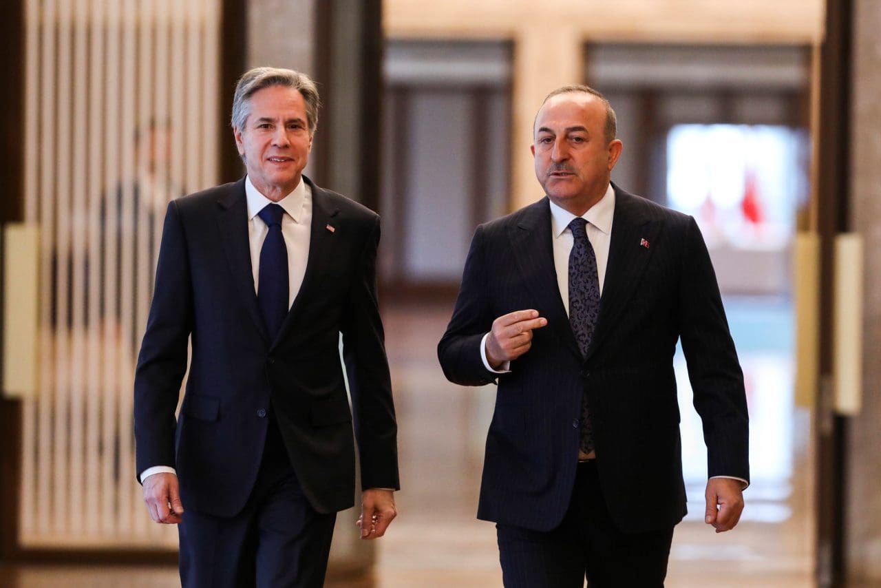U.S. Secretary of State Antony Blinken, left, and Turkish Foreign Minister Mevlut Cavusoglu arrive for their meeting in Ankara, Turkey, Monday, Feb. 20, 2023.