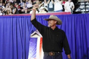 Pinal County sheriff Mark Lamb waves to a cheering crowd at a Save America Rally Friday, July 22, 2022, in Prescott, Ariz.
