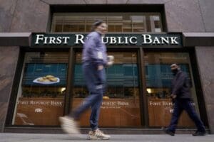 Pedestrians walk past the headquarters of First Republic Bank in San Francisco, Monday, May 1, 2023. The Fed's interest rate decision, announced on Wednesday, comes against the backdrop of both still-high inflation and the persistent turmoil in the banking industry.