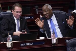 Florida Representatives Jason Shoaf, left, and Webster Barnaby chat during a break in a legislative session, Friday, April 30, 2021, at the Capitol in Tallahassee, Fla. (AP Photo/Wilfredo Lee)