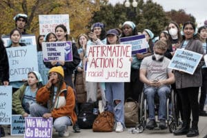 Activists demonstrate as the Supreme Court hears oral arguments on a pair of cases that could decide the future of affirmative action in college admissions, in Washington, Oct. 31, 2022.