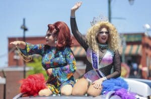 Pageant winners throwing out beads during the Memphis PRIDE Festival & Parade on June 4, 2022, in Memphis, Tennessee.