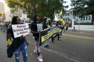 Jackson residents and supporters march with members of the Poor People's Campaign of Mississippi to the Governor's Mansion in Jackson, Miss., to protest water system problems, poverty and other issues, Oct. 10, 2022.