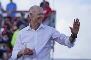 Sen. Rick Scott, R-Fla., arrives to speak before former President Donald Trump at a campaign rally in support of the campaign of Sen. Marco Rubio, R-Fla., at the Miami-Dade County Fair and Exposition on Nov. 6, 2022, in Miami.