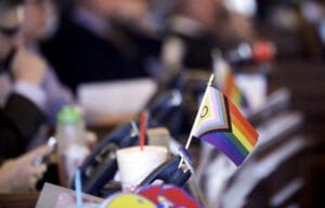 A flag supporting LGBTQ+ rights decorates a desk on the Democratic side of the Kansas House of Representatives during a debate, March 28, 2023, at the Statehouse in Topeka, Kan.