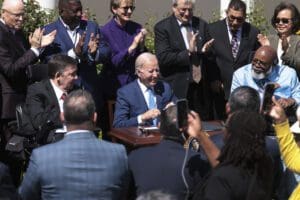 U.S. President Joe Biden signs an executive order related to childcare and eldercare during an event on making child care more affordableÊin the Rose Garden of the White House in Washington, DC on April 18, 2023.