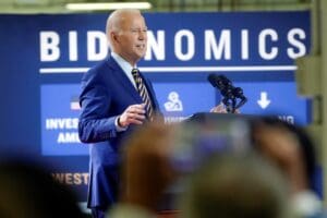 President Joe Biden speaks during a stop at a solar manufacturing company that's part of his 