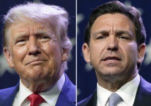 This combination of photos shows Republican presidential candidates former President Donald Trump, left, and Florida Gov. Ron DeSantis at the Republican Party of Iowa's 2023 Lincoln Dinner in Des Moines, Iowa, Friday, July 28, 2023.